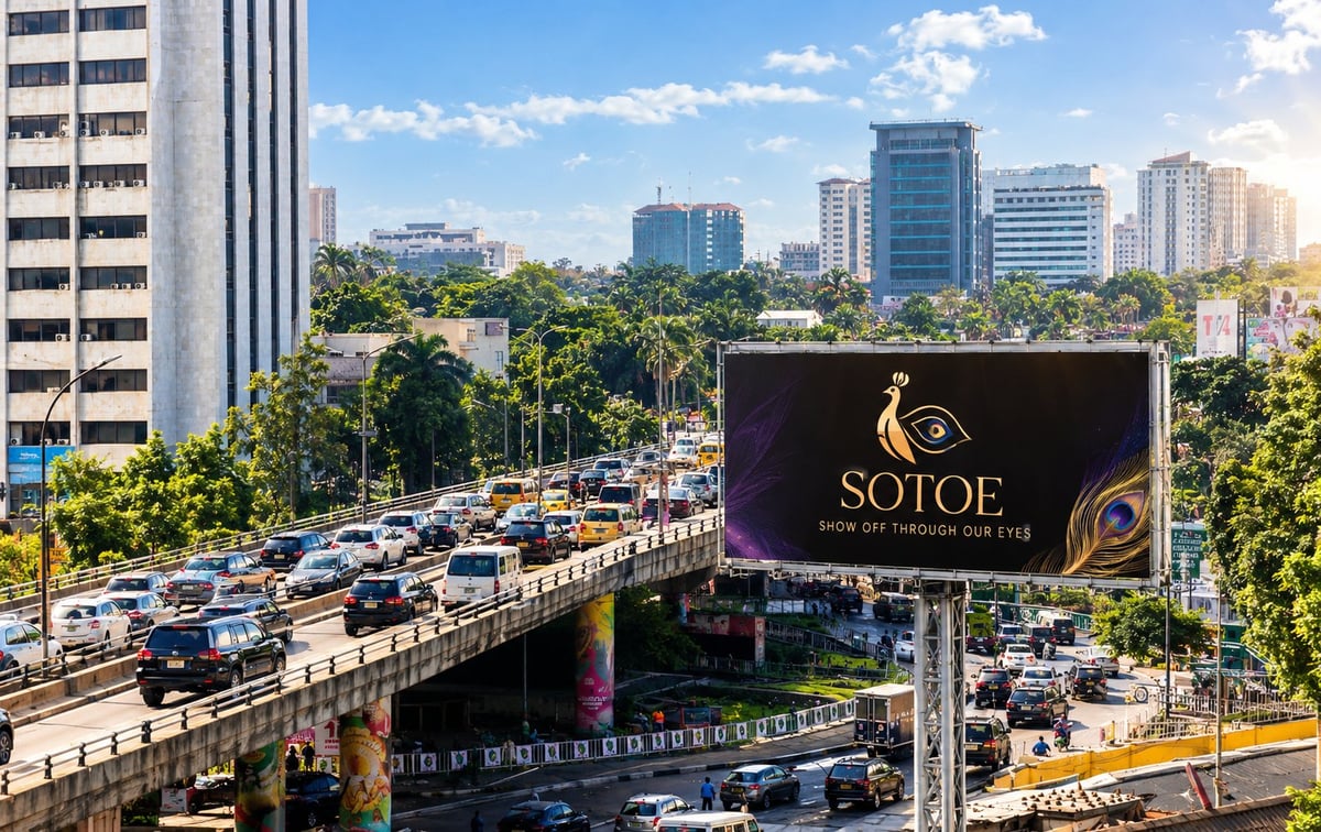 Digital billboard at Falomo Roundabout, Ikoyi, Lagos, above heavy traffic with an office skyline behind